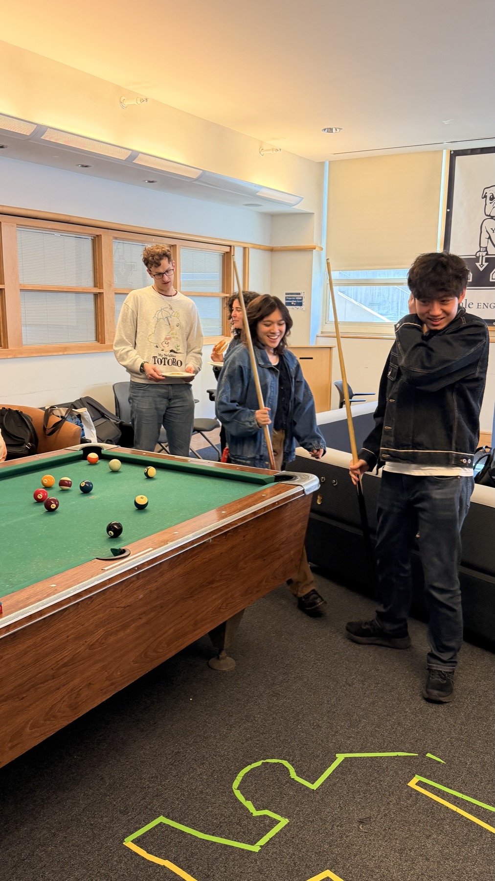 Amoriem Labs members playing pool